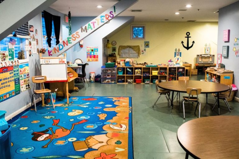 engaging design of nursery room with colorful and kid friendly floor mat and wall different angle designs at a Childcare Serving Branford, Cheshire, Wallingford, CT