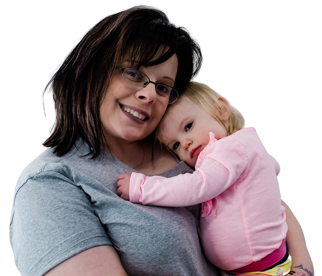 Happy mother hugging her adorable toddler girl at a Childcare Serving Branford, Cheshire, Wallingford, CT