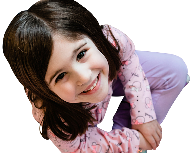 Cute little girl smiling wearing pink hello kitty jacket at a Childcare Serving Branford, Cheshire, Wallingford, CT